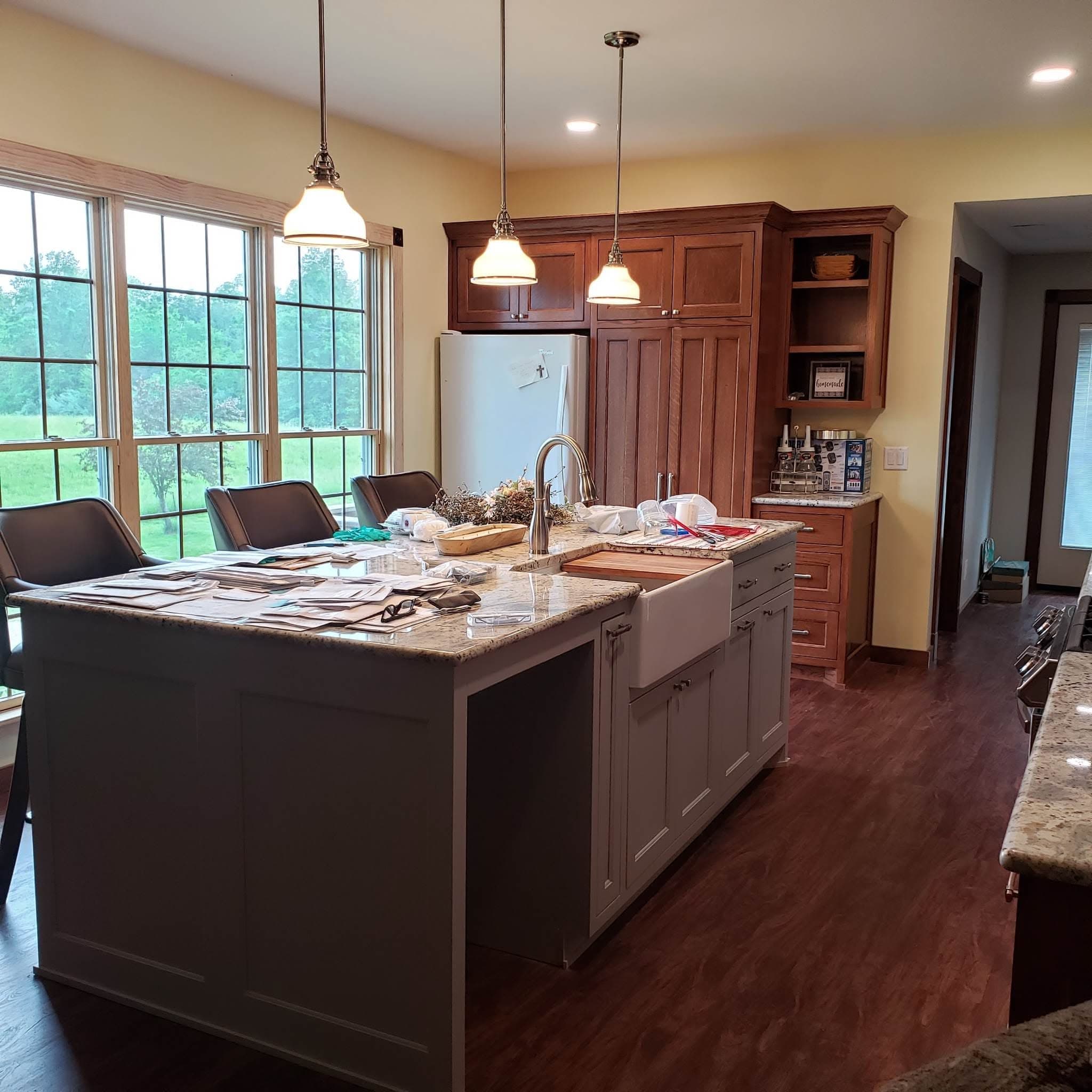 Cherry kitchen with large island and farmhouse sink